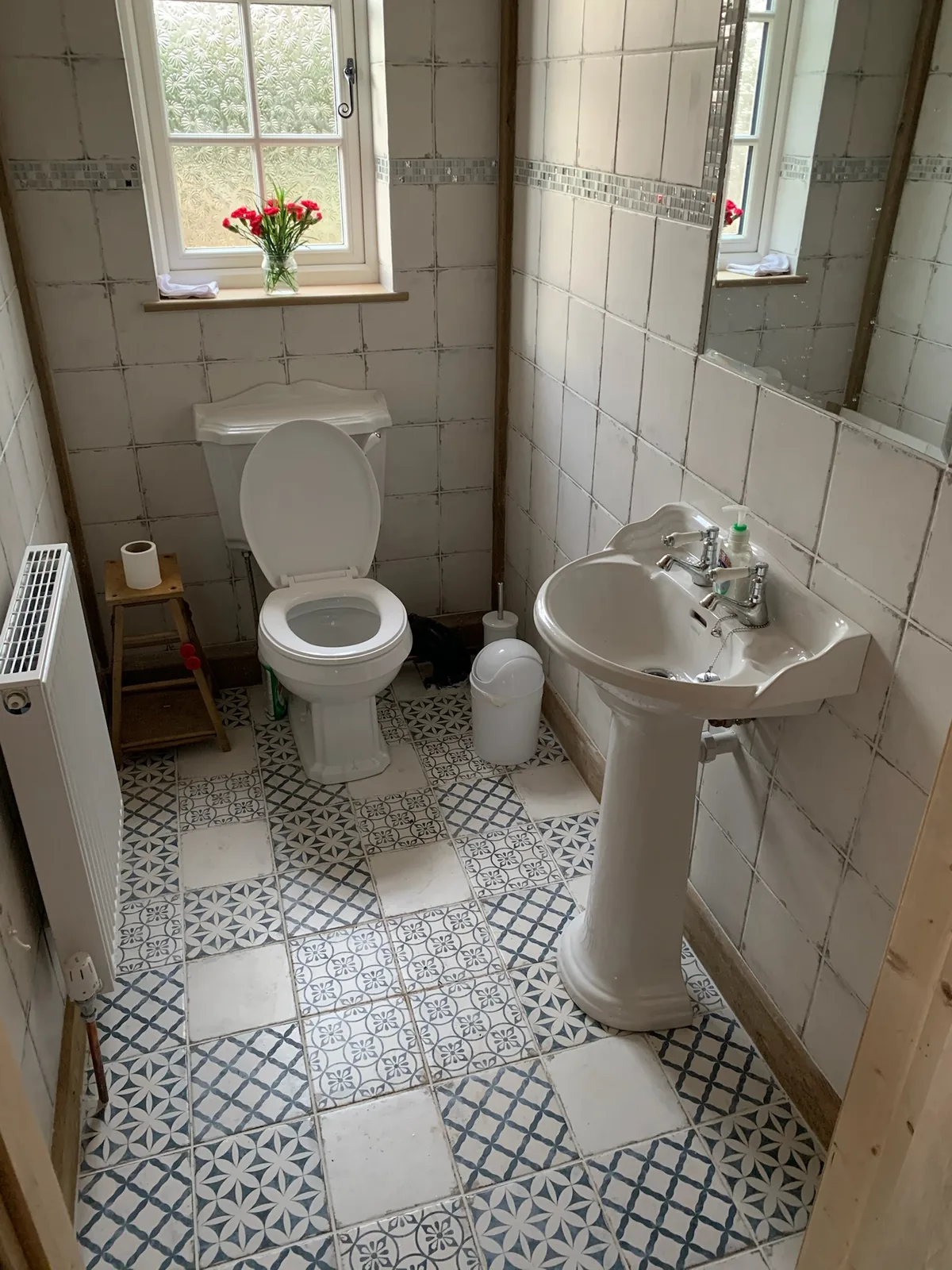 Traditional bathroom with pedestal basin and patterned encaustic floor