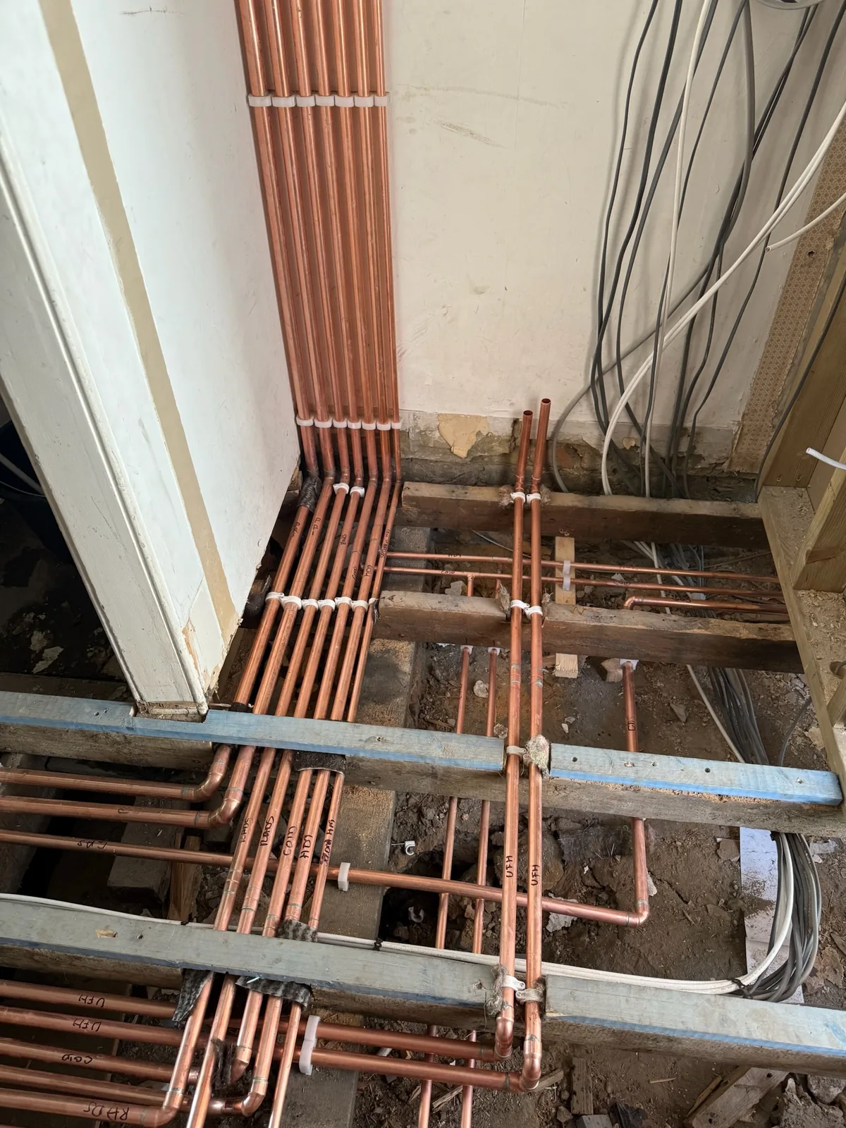 First-fix copper pipework with multiple drops in a London home